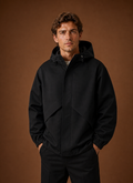 Men's lightweight hooded windbreaker jacket featuring a streamlined fit, ideal for outdoor activities and casual wear, available in various colors. 0