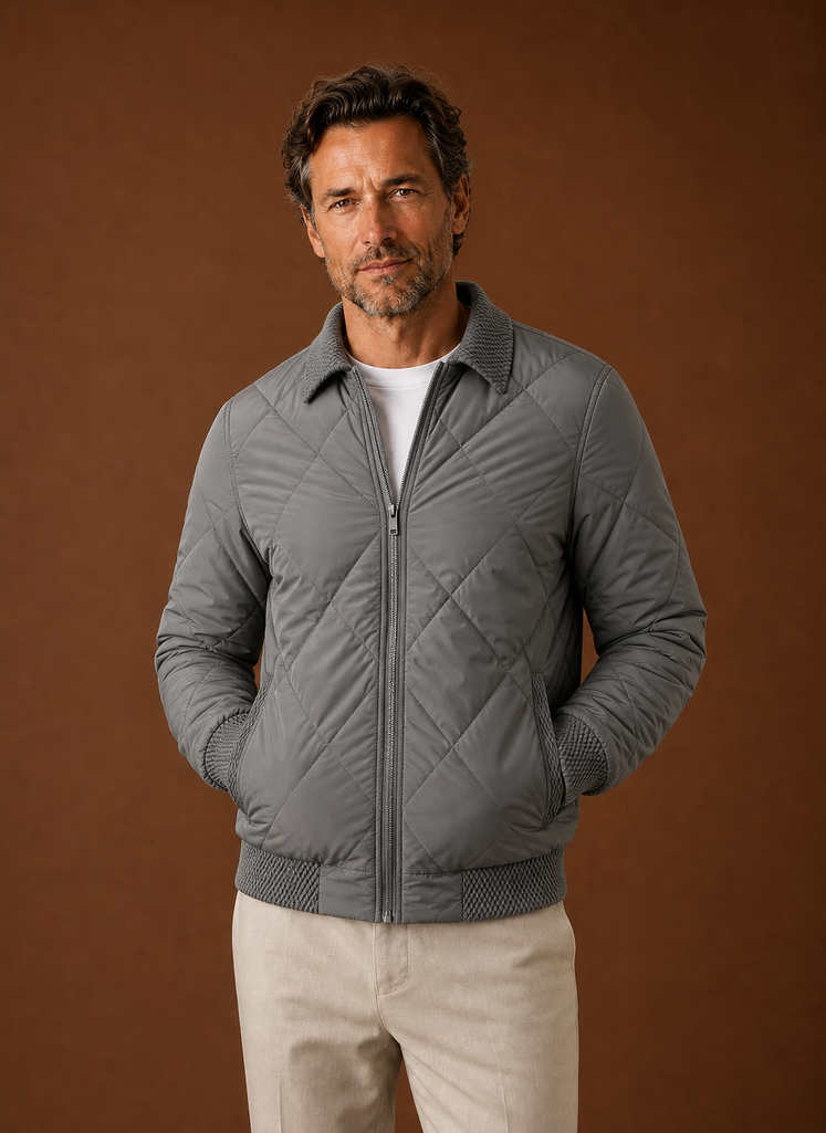 Men's Quilted Bomber Jacket featuring a zip closure and ribbed trim, perfect for casual styling and warmth in cooler weather. 0