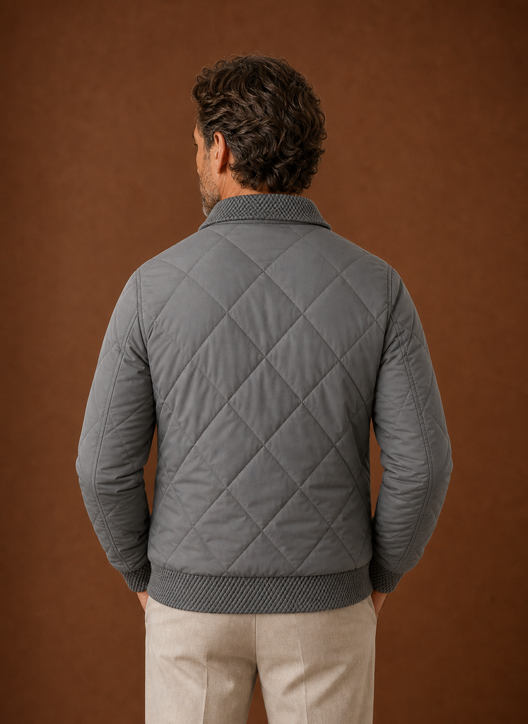 Men's Quilted Bomber Jacket featuring a zip closure and ribbed trim, perfect for casual styling and warmth in cooler weather. 2