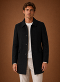 Men's tailored long overcoat featuring a structured fit, perfect for stylish winter wear, showcasing a classic design in a warm fabric. 0